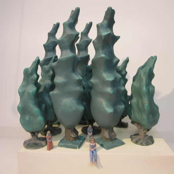 sculpture of trees and women